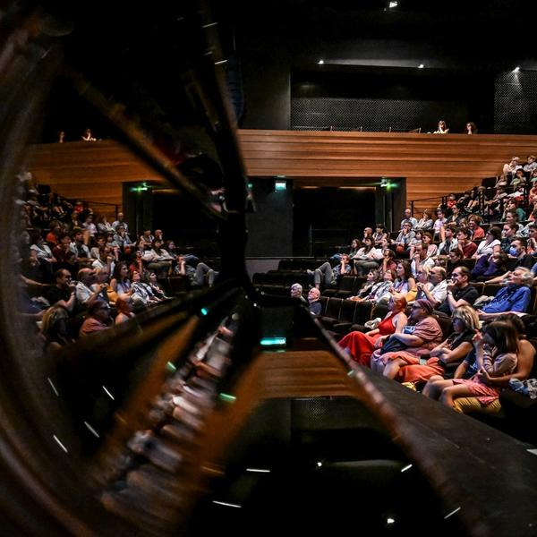 Cinema audience reflected in a grand piano at Festival La Rochelle Cinéma